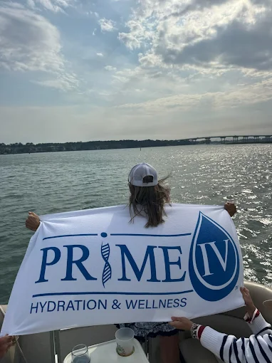 Prime IV Bluffton flag held up on a boat in the Lowcountry