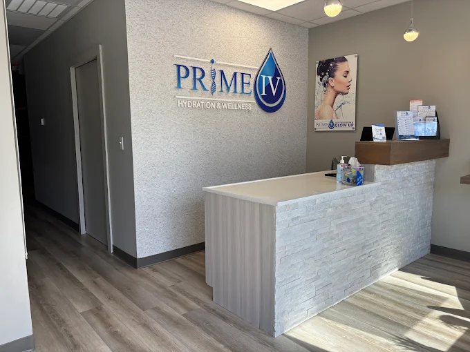 Prime IV Bluffton reception desk and logo wall